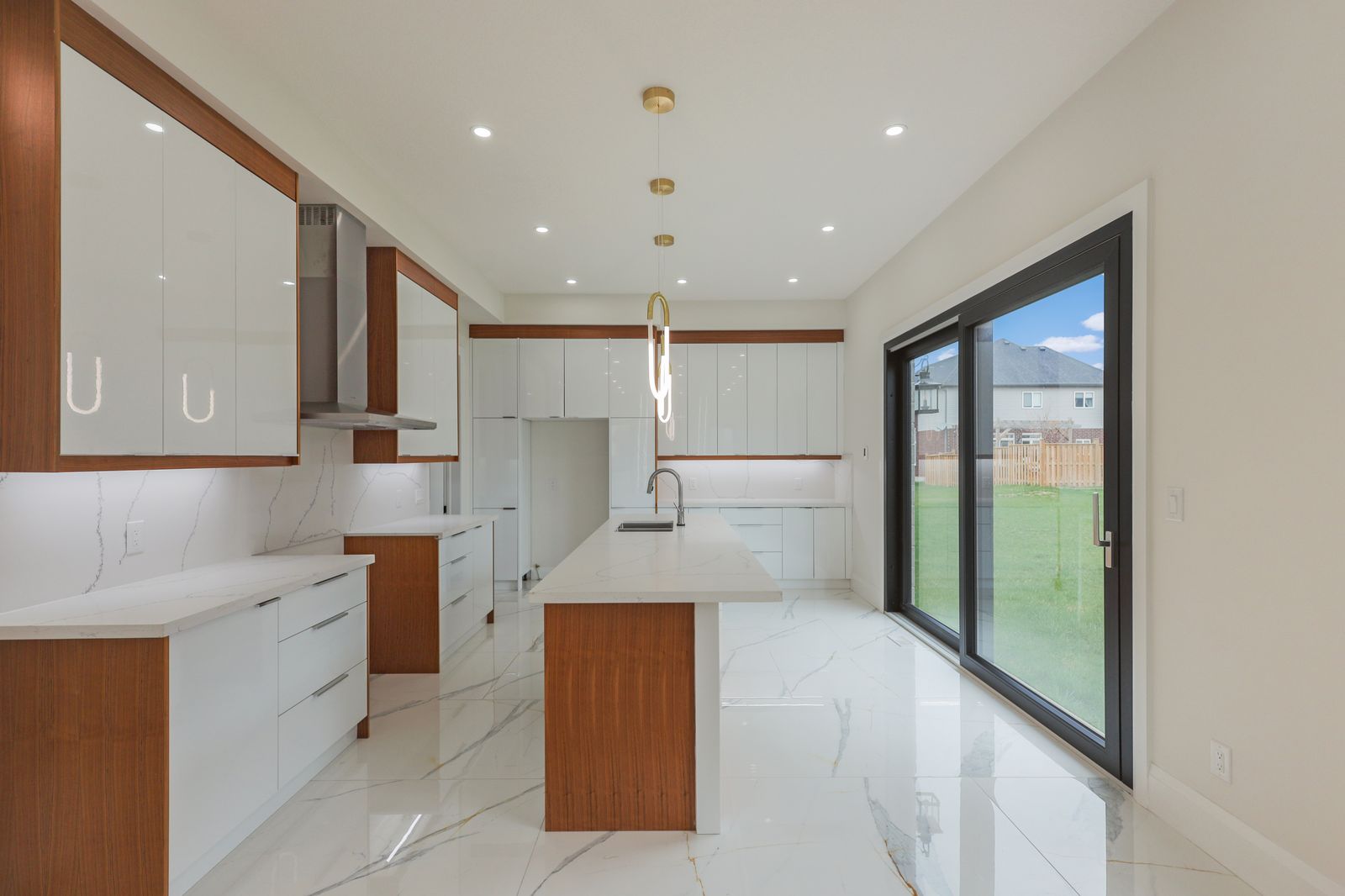 Galley kitchen opening to the garden in a completed Carnaby home
