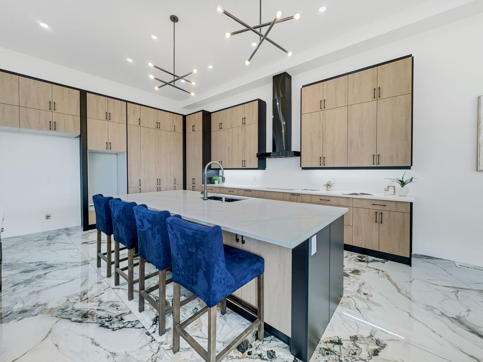 Custom island with seating for six in a completed Carnaby home